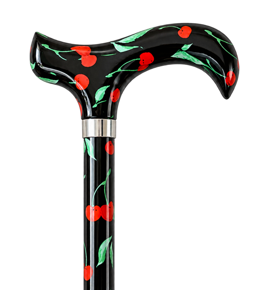 Canne noire à motif cerises et poignée Derby sur fond transparent
